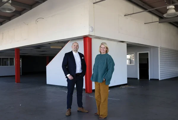 Jacob Shafer and Christine Winge standing inside the purchased building in Seaside that will be renovated into a Meals on Wheels kitchen.