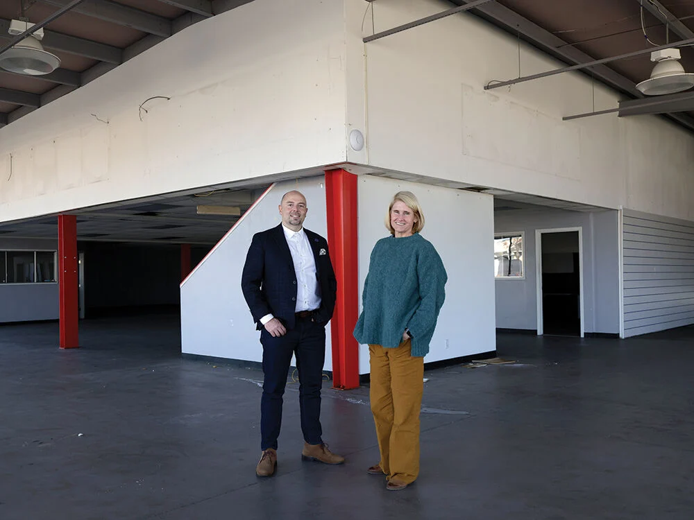 Jacob Shafer and Christine Winge standing inside the purchased building in Seaside that will be renovated into a Meals on Wheels kitchen.