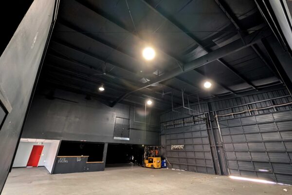 Interior view of the purchased building for the second Meals on Wheels of the Monterey Peninsula kitchen showing a large open concrete space.