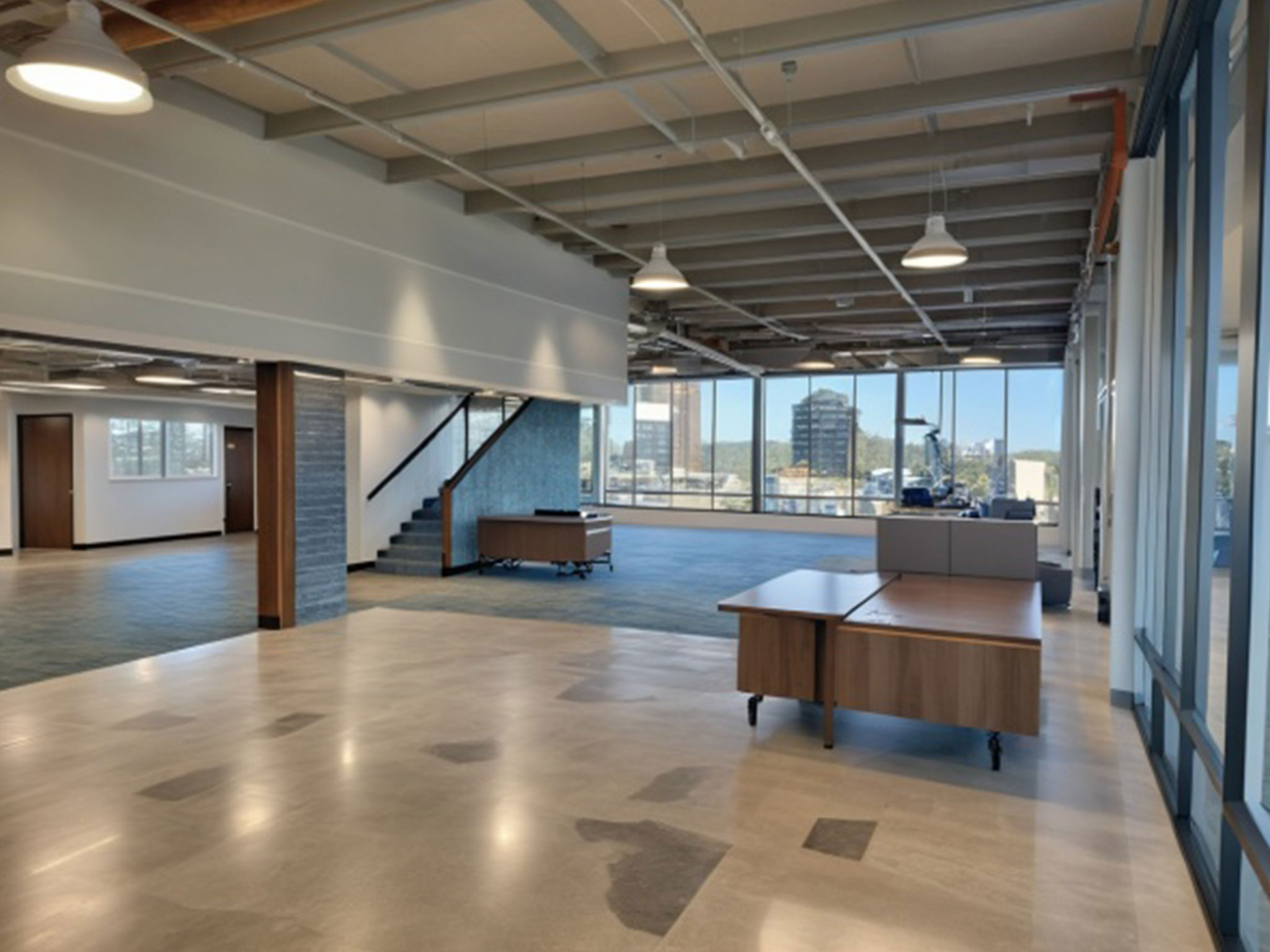 Proposed interior concept rendering of the new Meals on Wheels of the Monterey Peninsula facility showing an open workspace with natural light.