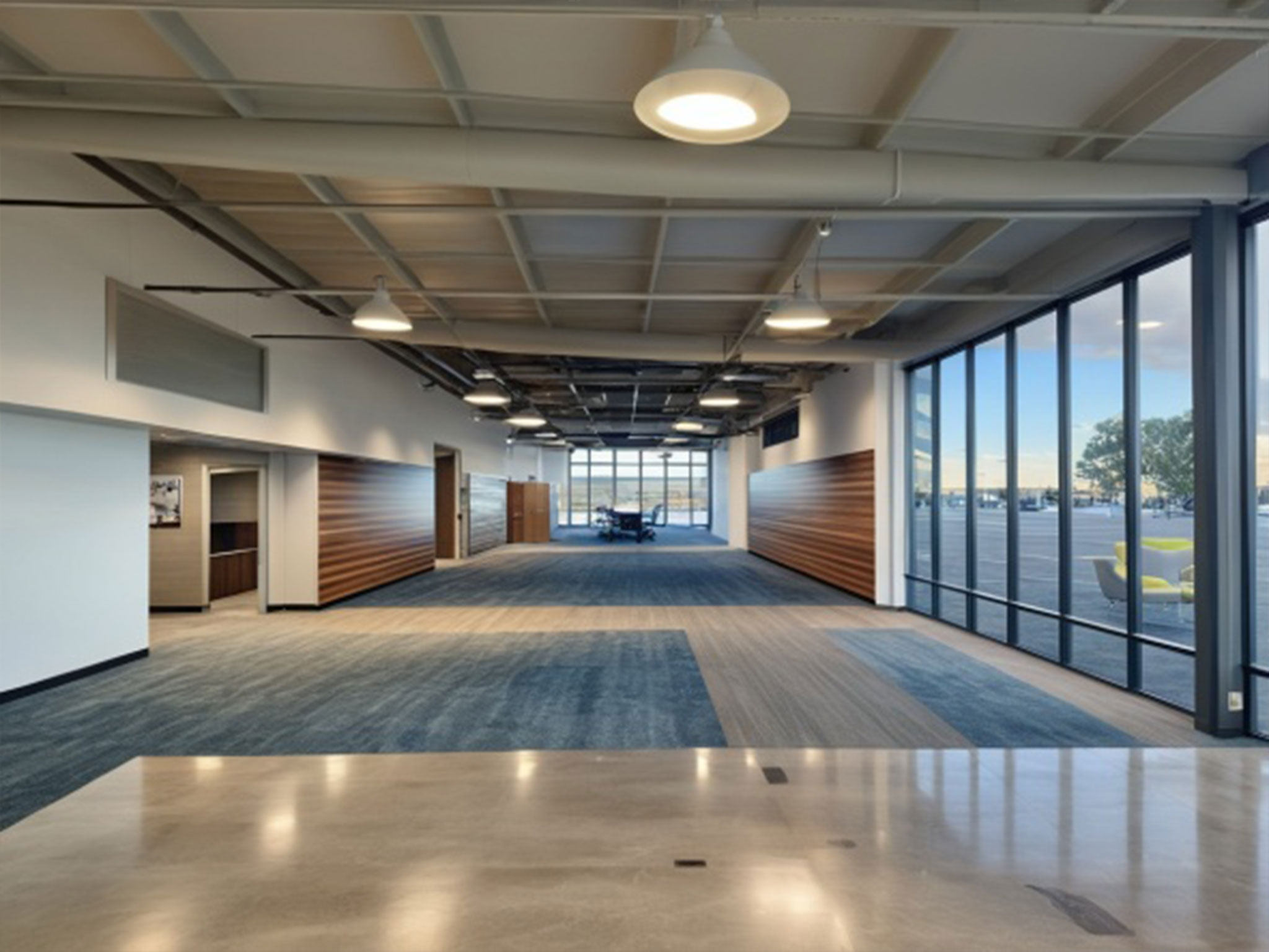 Proposed interior concept rendering of the new Meals on Wheels of the Monterey Peninsula facility showing an open lobby and meeting area.
